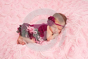 Newborn Baby Girl Wearing a Crocheted Romper photo