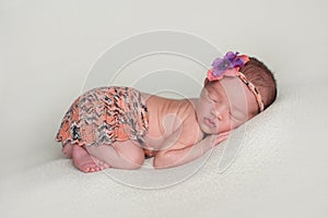 Newborn Baby Girl Wearing an Orange Mini Skirt
