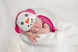 Newborn Baby Girl Wearing a Pink Snowgirl Costume