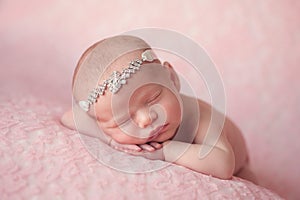 Newborn Baby Girl Wearing a Rhinestone Headband