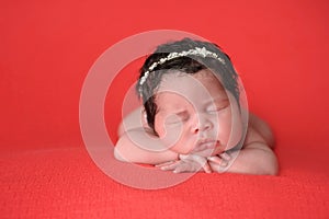 Newborn Baby Girl Wearing a Rhinestone Headband