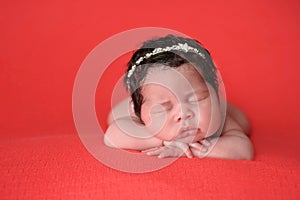 Newborn Baby Girl Wearing a Rhinestone Headband photo