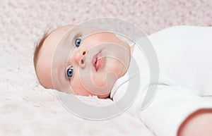 Newborn baby girl with white bodysuit