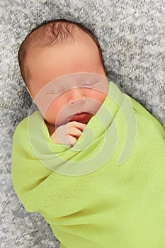 Newborn baby in green