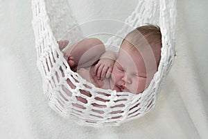Newborn baby in hammock
