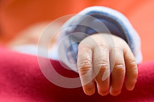 Newborn baby hand (Close-up, soft focus)