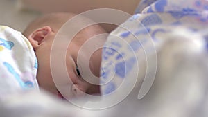 Newborn baby having hiccups and possetting after feeding