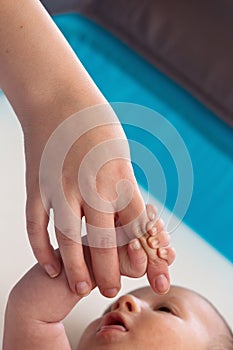 Newborn Baby Holding Mommy Hand