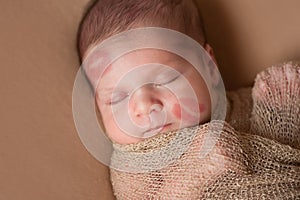 Newborn Baby with Lipstick Kisses on Face