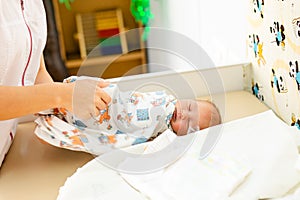 Newborn baby. Little child in medicine hospital. Medical health care. Doctor pediatrician. Small kid, infant in clinic. Healthy