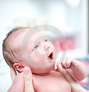 Newborn baby with look of wonderment
