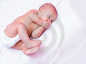 Newborn baby looking at the camera