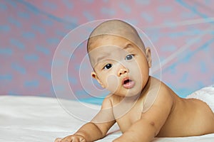 Newborn baby looking at the camera