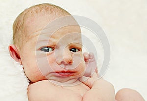 Newborn baby looking funny