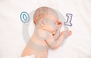 Newborn baby lying in bed