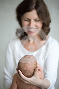 Newborn baby in mom hands