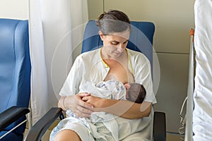 Newborn baby in mother`s arms in photo