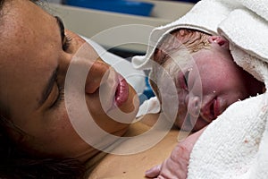 Newborn baby and mother together