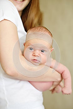 Newborn baby on mothers hands