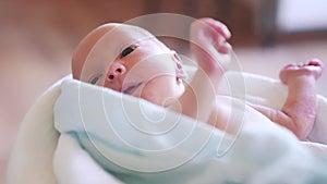 newborn. baby newborn a close-up lies looking at the camera in the hospital maternity hospital. happy family baby