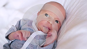 newborn. baby newborn a close-up lies looking at the camera in the hospital maternity hospital. happy family baby dream