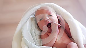 newborn. baby newborn a close-up lies looking at the camera in the hospital maternity hospital. happy family baby dream