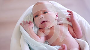 newborn. baby newborn close-up lies looking at the camera in the hospital maternity hospital. happy family baby dream