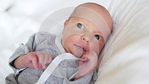 newborn. baby newborn a close-up lies looking at the camera in the hospital maternity hospital. happy family baby dream