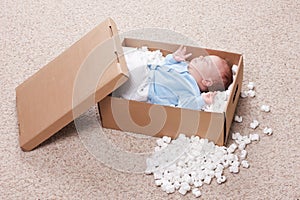 Newborn baby in open post box