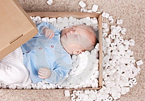 Newborn baby in open post box