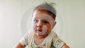 Newborn baby play with parents on a gym ball