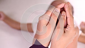 Newborn Baby`s feet in mother`s hands