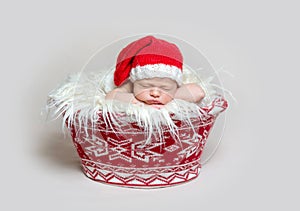 Newborn baby in santa claus bonnet