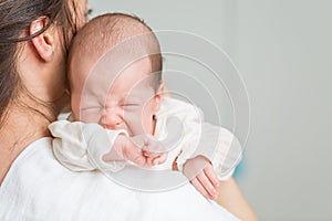 Newborn baby screaming in pain with colic photo