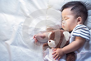 Newborn baby sleep with teddy bear