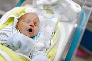 Newborn baby sleeping in the delivery room