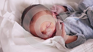 newborn baby sleeping. happy family a maternity hospital hospital kid dream concept. newborn close-up. little fun girl
