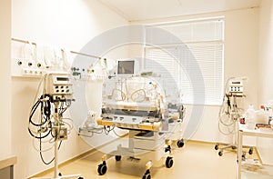Newborn baby sleeping in an incubator in hospital