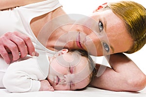 Newborn baby sleeping with mother