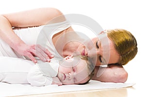 Newborn baby sleeping with mother