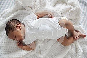 Newborn Baby Sleeping In Nursery Cot