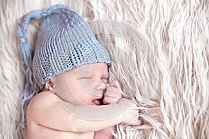 Newborn baby sleeping on white background