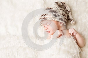 Newborn, baby sleeping in white bed, beautiful new born infant portrait