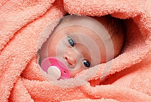 Newborn baby with soother