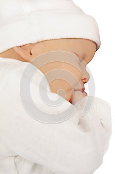 Newborn baby sucking on her thumb