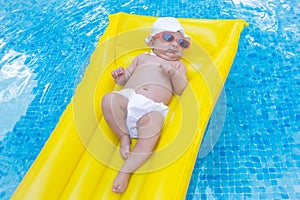 Newborn baby on summer mattress