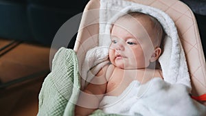 newborn baby swinging in a rocking chair. happy family kid dream concept. baby newborn lifestyle close-up looking at the