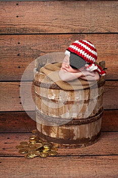 Newborn Baby Wearing a Pirate Hat and Eye Patch