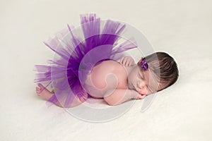 Newborn Baby Wearing a Purple Tutu