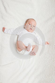 Newborn baby in white romper